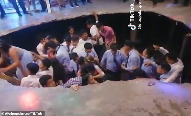 Once the dust settled and the students got to their feet they started clambering out of the hole