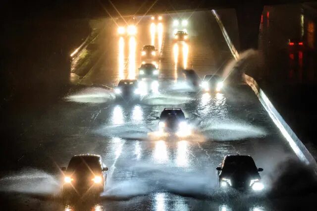 Click to enlarge Drivers barrel into standing water on Interstate 101 in San Francisco on 4 January.