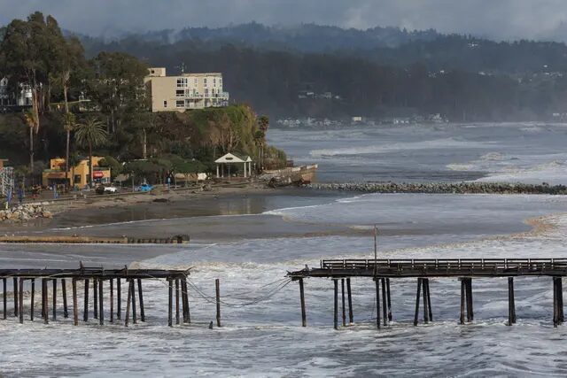 Click to enlarge A damaged pier is seen in Santa Cruz after an ‘atmospheric river’ slammed into the state on 5 January.