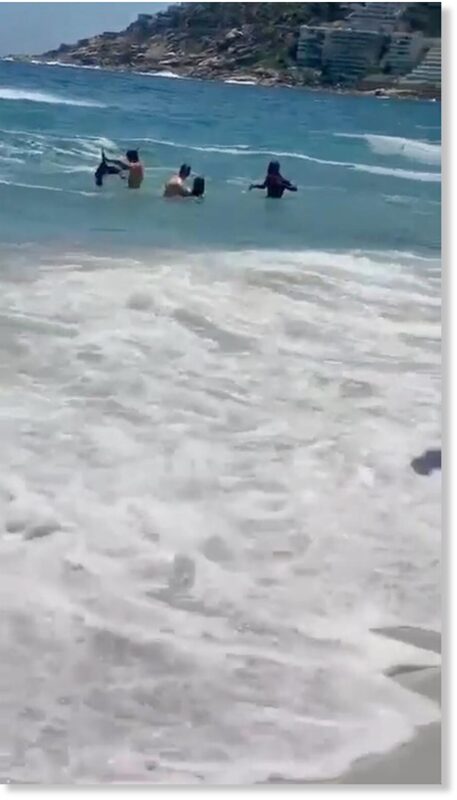 Bystanders rush to Taylor’s rescue.