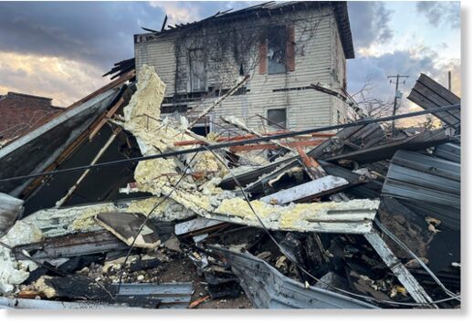 A damaged structure and debris in the aftermath of the tornado in Selma, Alabama.