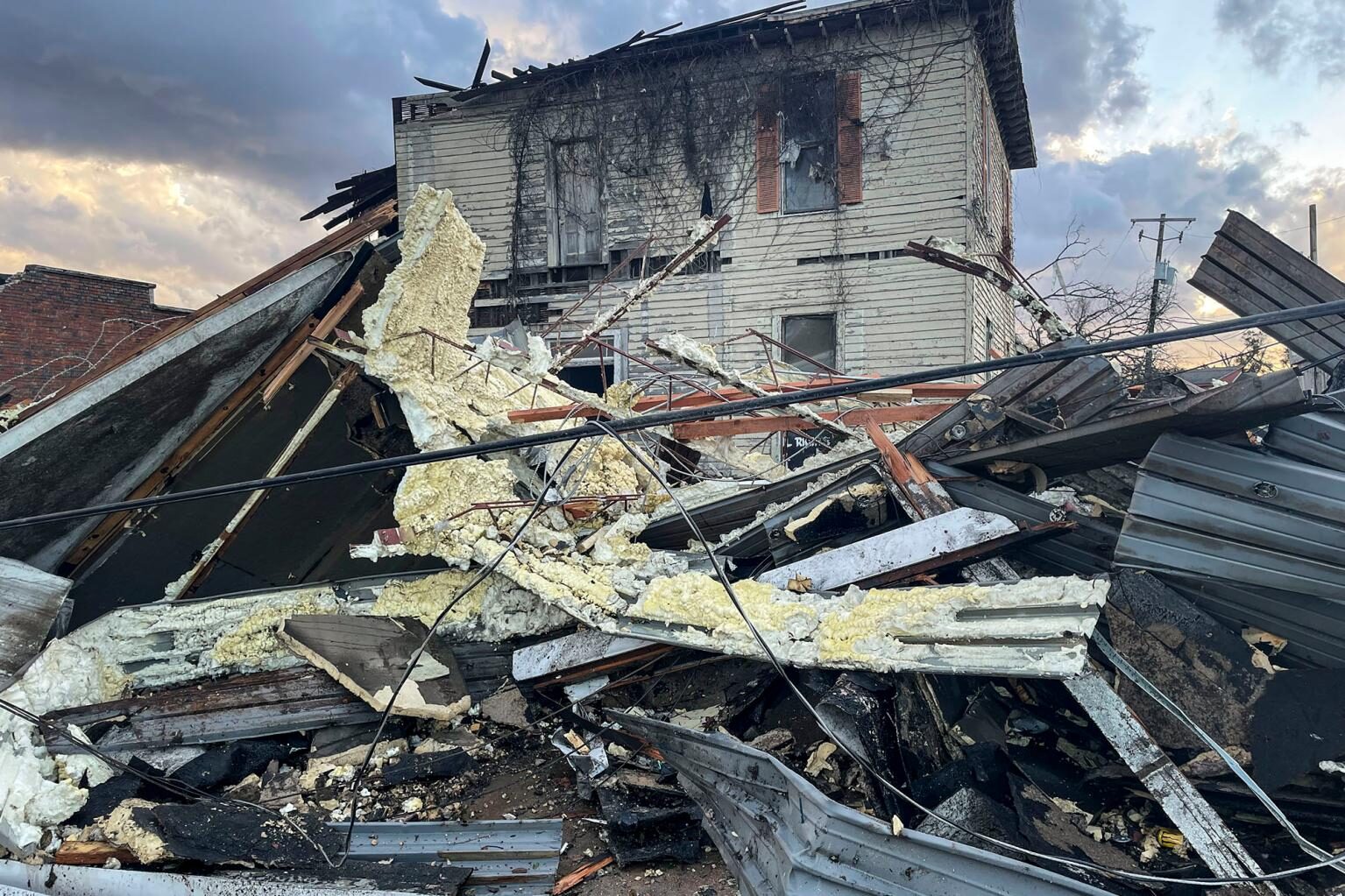 Click to enlarge A damaged structure and debris in the aftermath of the tornado in Selma, Alabama.