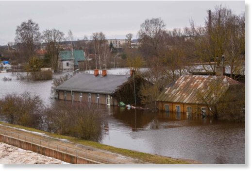 Flooded houses are pictured in Jekabpils, Latvia, on January 15, 2023.