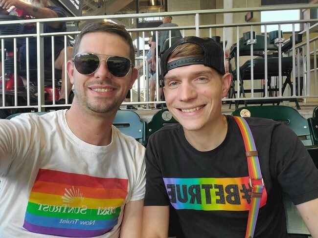 Click to enlarge Zachary (left) in his rainbow-colored SunTrust T-shirt