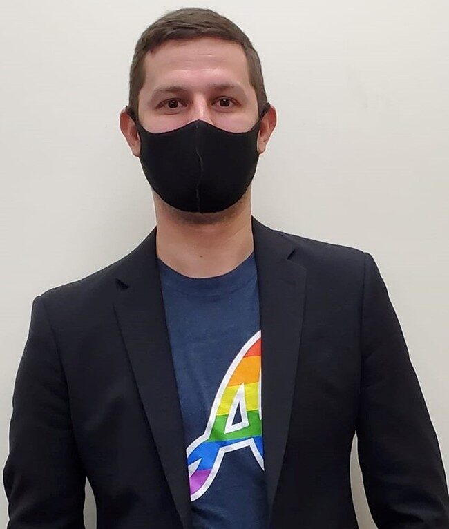 Click to enlarge Zachary Zulock dressed for work in a rainbow Atlanta Braves shirt