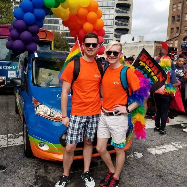 Click to enlarge Zachary (left) and William Zulock (right) carrying rainbow