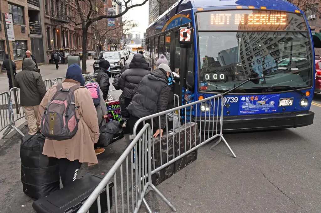 Click to enlarge Migrants NYC bus