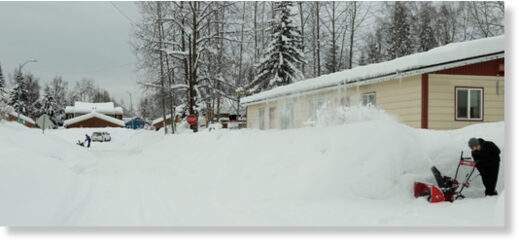 Anchorage residents clear snow on Monday.