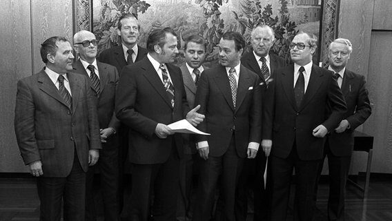 Click to enlarge Hans Puvogel (second from left) with Albrecht (center) and his Cabinet, 1977.