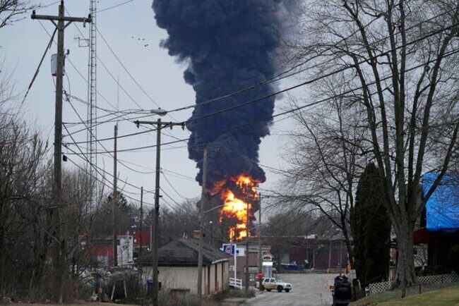 Click to enlarge A black plume rises over East Palestine