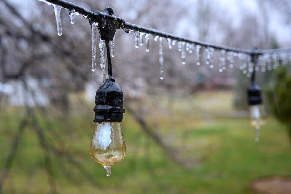 Ice forms on a string of light at a home on Grosse Ile, Wednesday, February 22, 2023.