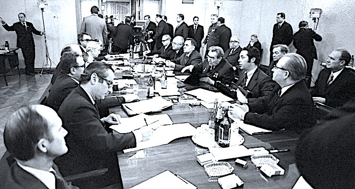 Click to enlarge men at table