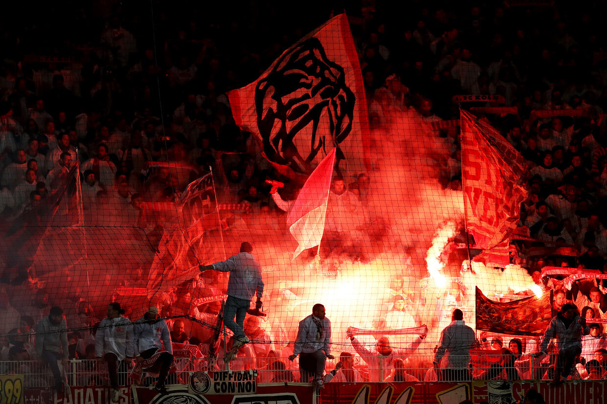 FC Köln fans light flares during the match