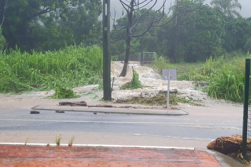Cedar Road at Palm Cove, north of Cairns,  was in full flood on Monday morning.