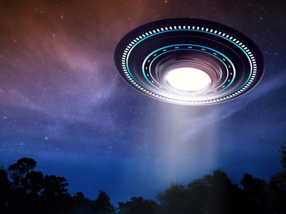 Click to enlarge A rendering of an alien spaceship or UFO in the sky.