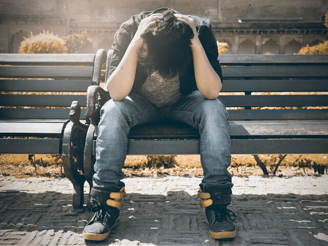 depressed youth park bench