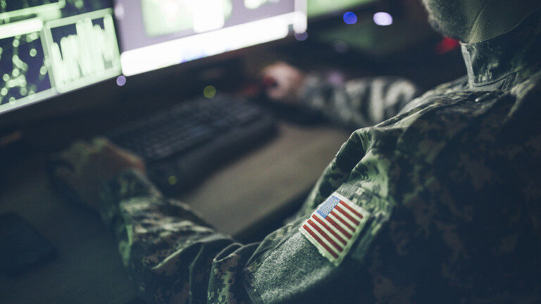 U.S. military agent at computer