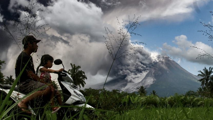 Click to enlarge Thick smoke rises during an eruption from Mount