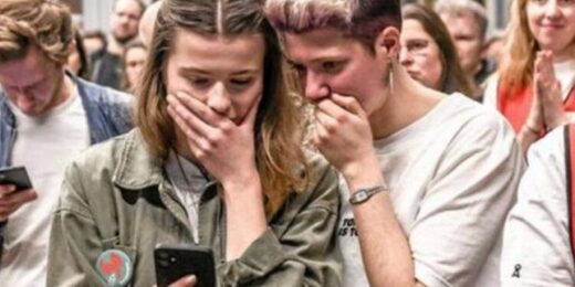 reading shocking news on phone