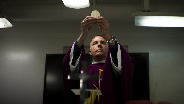 Click to enlarge Navy Chaplain Lt. Cmdr. Ben Garrett