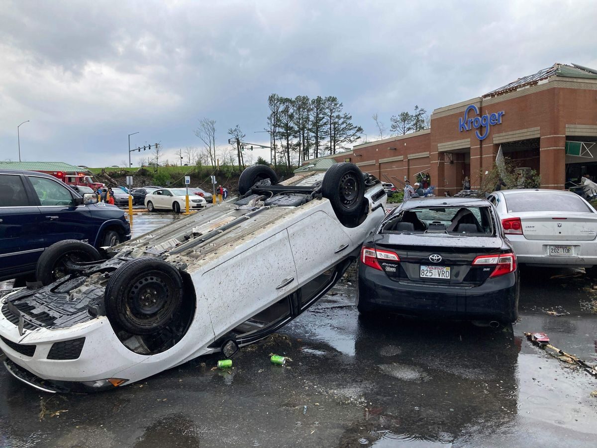 A car is upturned in a parking lot after the severe
