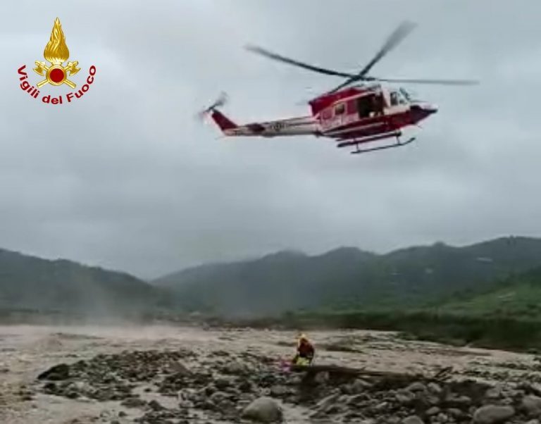 Click to enlarge Fire service helicopter searching for missing man in floods in Corigliano-Rossano, Calabria, Italy, 03 April 2023