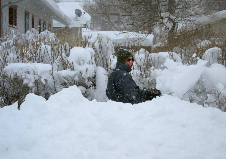 Charlie Powell clears his sidewalk in