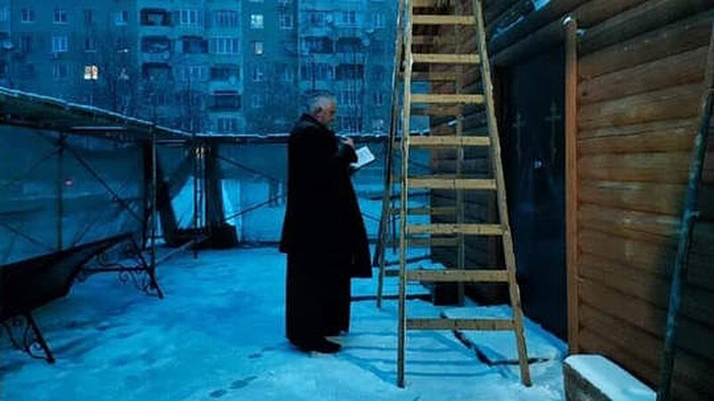priest pray demolished church lviv