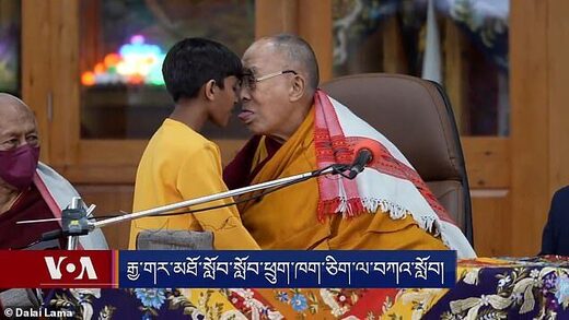 Dalai Lama apologises after kissing young boy and asking him to 'suck' his tongue, in bizarre interaction captured on video at charity event in India