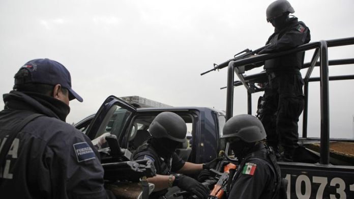 Click to enlarge Mexican federal police after drug sting.