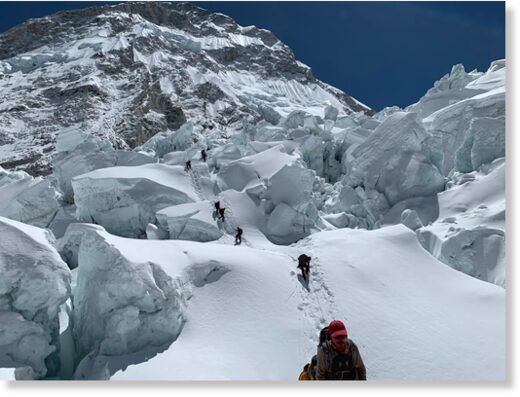 Climbers ascend the Khumbu Icefall on Mount Everest.