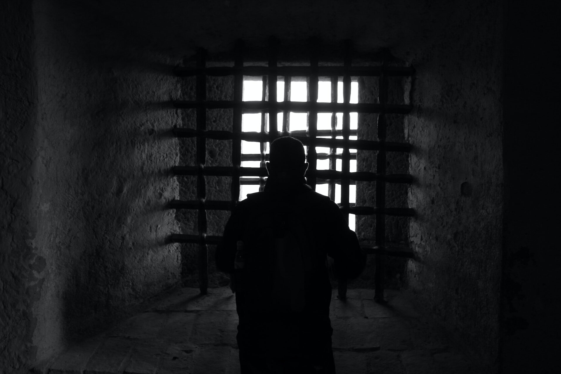 Click to enlarge man behind bars locked up prison