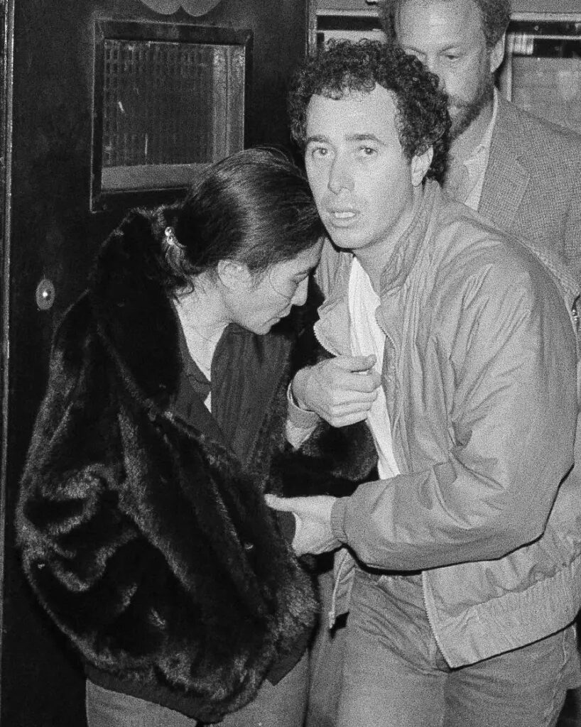 Click to enlarge Yoko Ono and record mogul David Geffen leave Roosevelt Hospital after the murder of John Lennon in Dec. 1980.