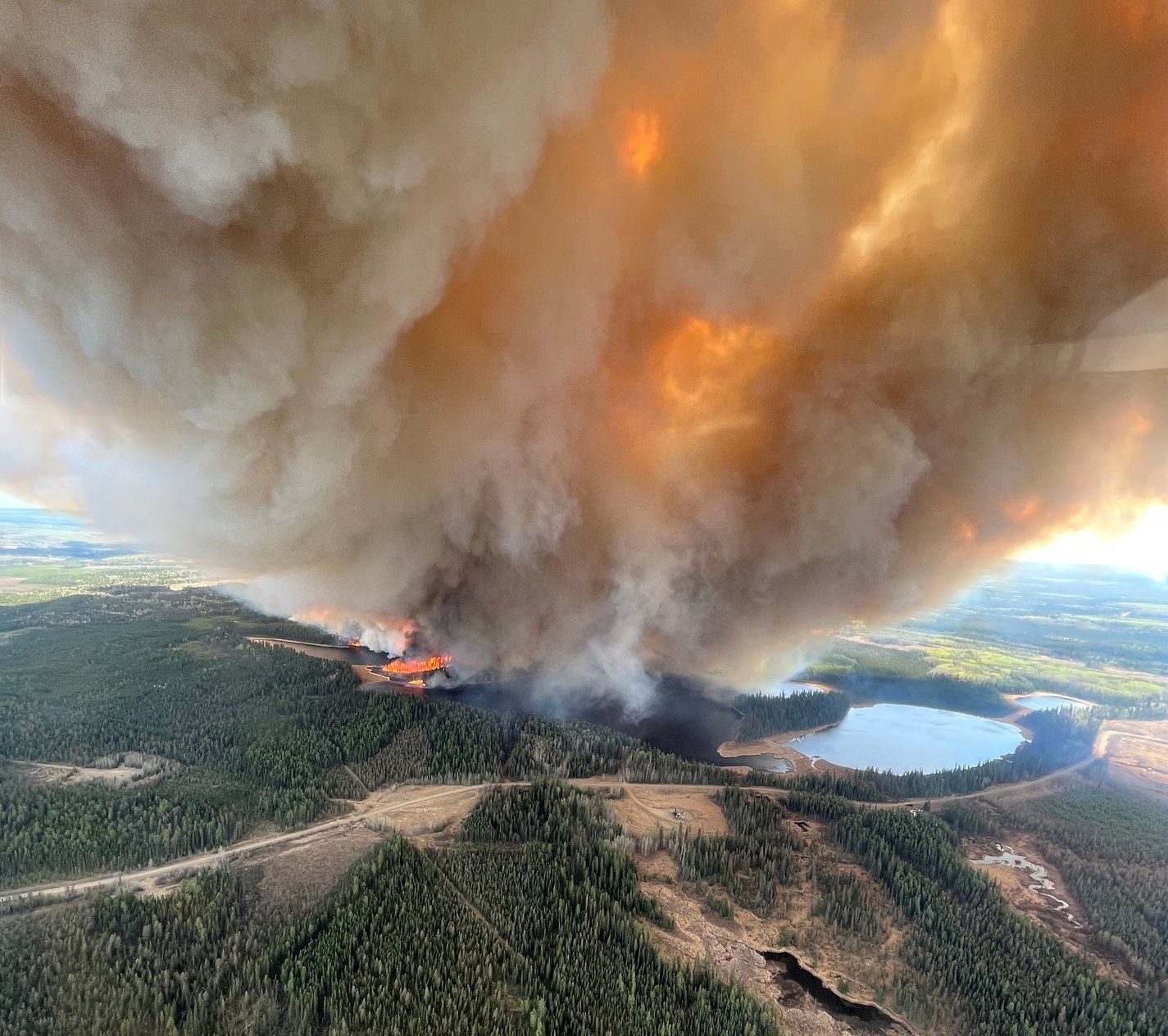 Click to enlarge A smoke column rises from wildfire EWF031 near Lodgepole, Alberta, Canada May 4, 2023.