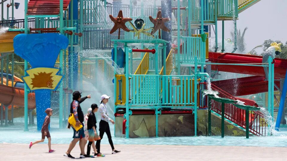 Visitors cool off at an amusement park in Hoi An, Vietnam.