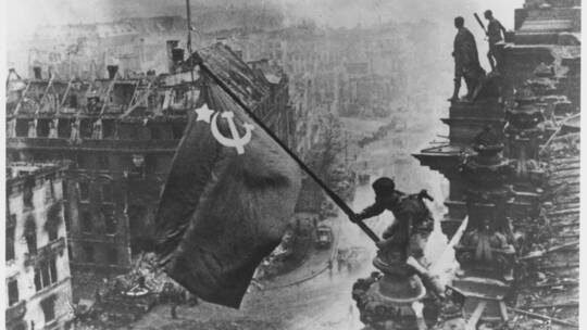 Russian soldiers flying the Red Flag