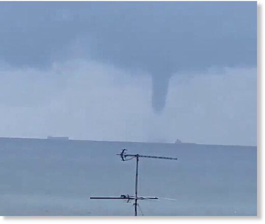 Click to enlarge A huge tornado-like water spout that dwarfed tankers (pictured) has been spotted off the coast of Sydney as a storm moves its way onto land