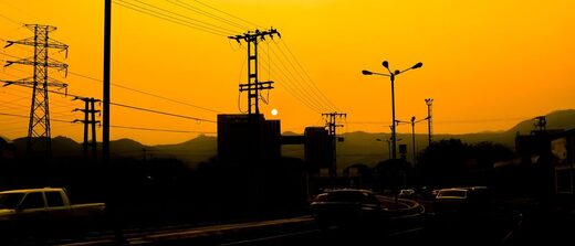 power lines energy crisis sunset