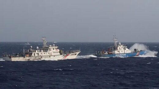 Click to enlarge A ship from the Vietnam Marine Guard, right, is seen near a ship from the Chinese Coast Guard in the South China