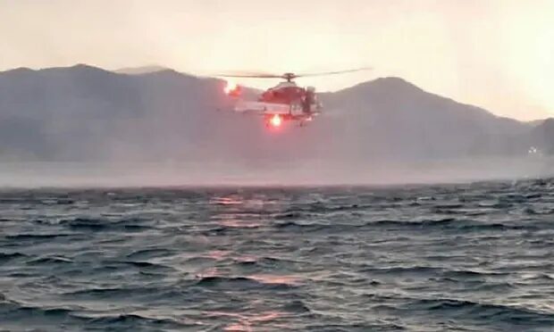 A search helicopter over Lake Maggiore.