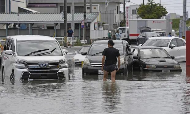 A flooded road from downpours s in Toyokawa, in central Japan’s Aichi prefecture, on Saturday.