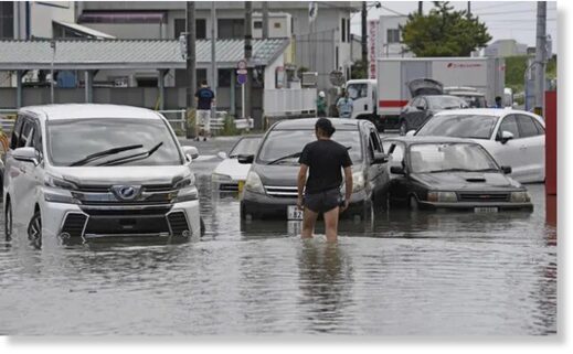 A flooded road from downpours s in Toyokawa, in central Japan’s Aichi prefecture, on Saturday.
