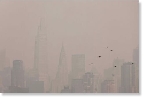 Click to enlarge The Manhattan skyline is seen covered in haze and smoke caused by a wildfire in Canada, June 7, 2023.