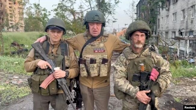 Click to enlarge Prigozhin and Two Wagners