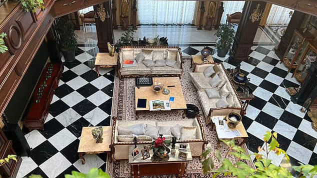 Click to enlarge A luxurious living area in the mansion, complete with a huge cinematic TV on the left