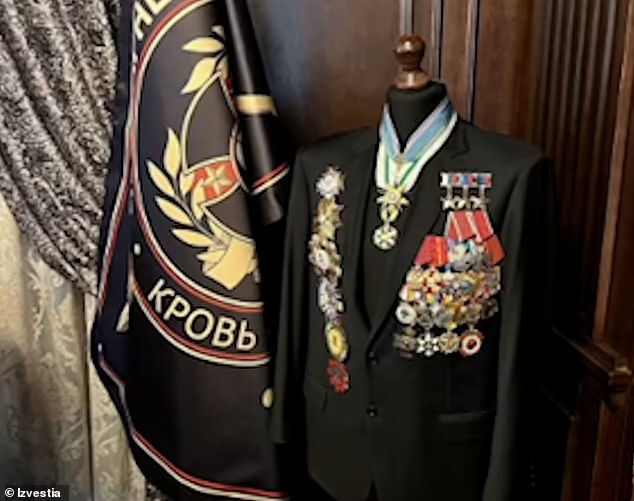 Click to enlarge Among the private military leader's valuable possessions photographed in his palace was a Russian military uniform decorated with around two dozen medals