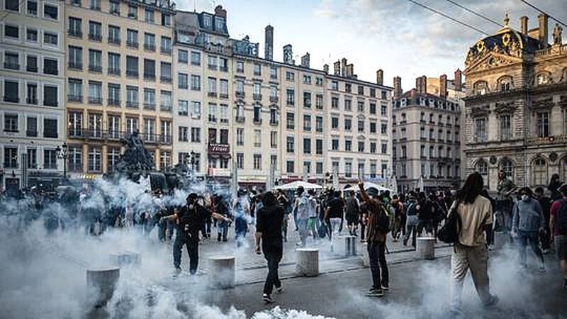 france riots tear gas migrants immigration