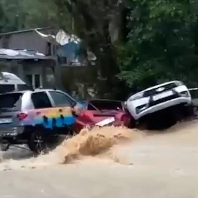 Remarkable footage shows how multiple cars were washed away as the Matsesta River burst its banks