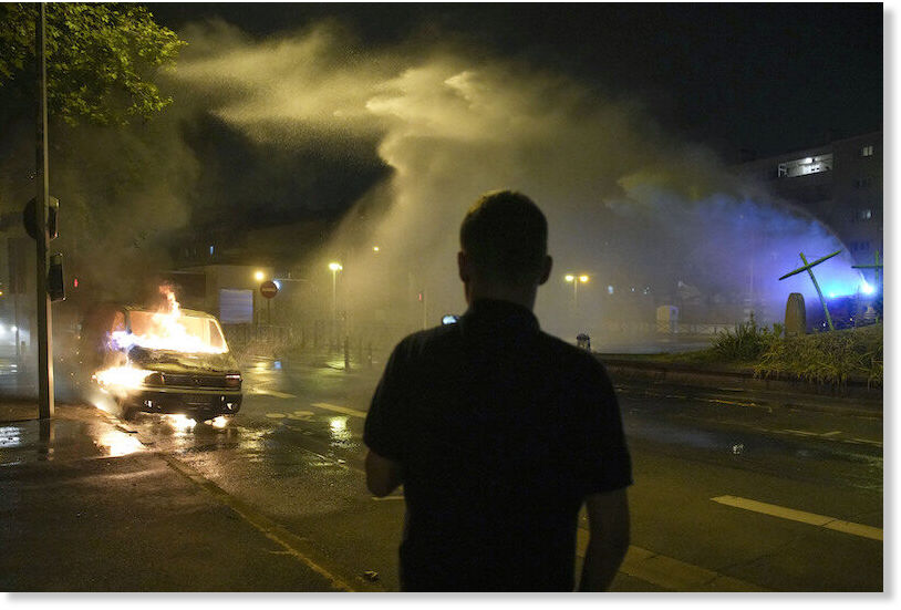 Firefighters use a water hose