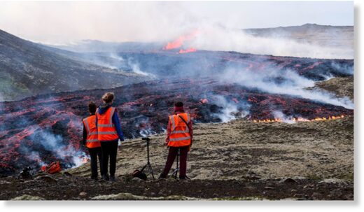 Click to enlarge Observers from the University of Iceland watch a volcanic eruption near Litli Hrutur, Iceland on July 10, 2023.